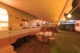 Auvent camping-car deploye et eclaire lors d une soiree en camping